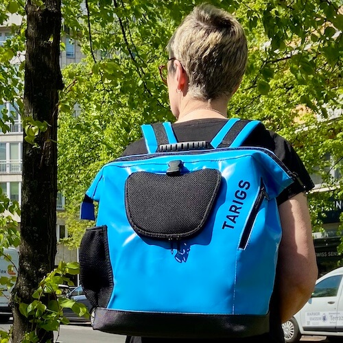 Woman with blue dog backpack from TARIGS