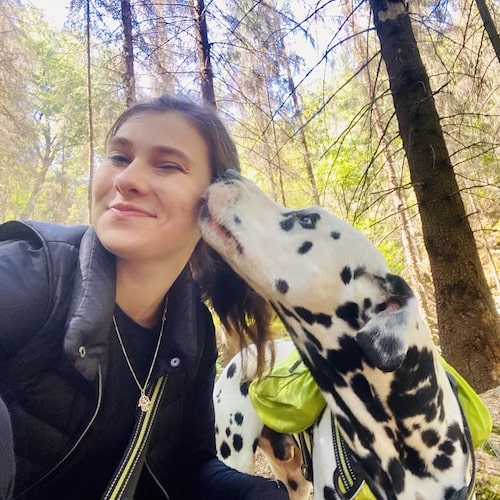 Woman with her Dalmatian on a hike