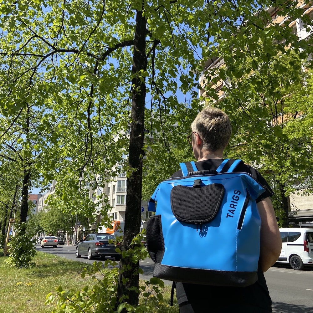 Woman carries MountainRock Backpack in Special Edition Dark Sky Blue.
